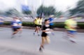 Marathon runners running on the street